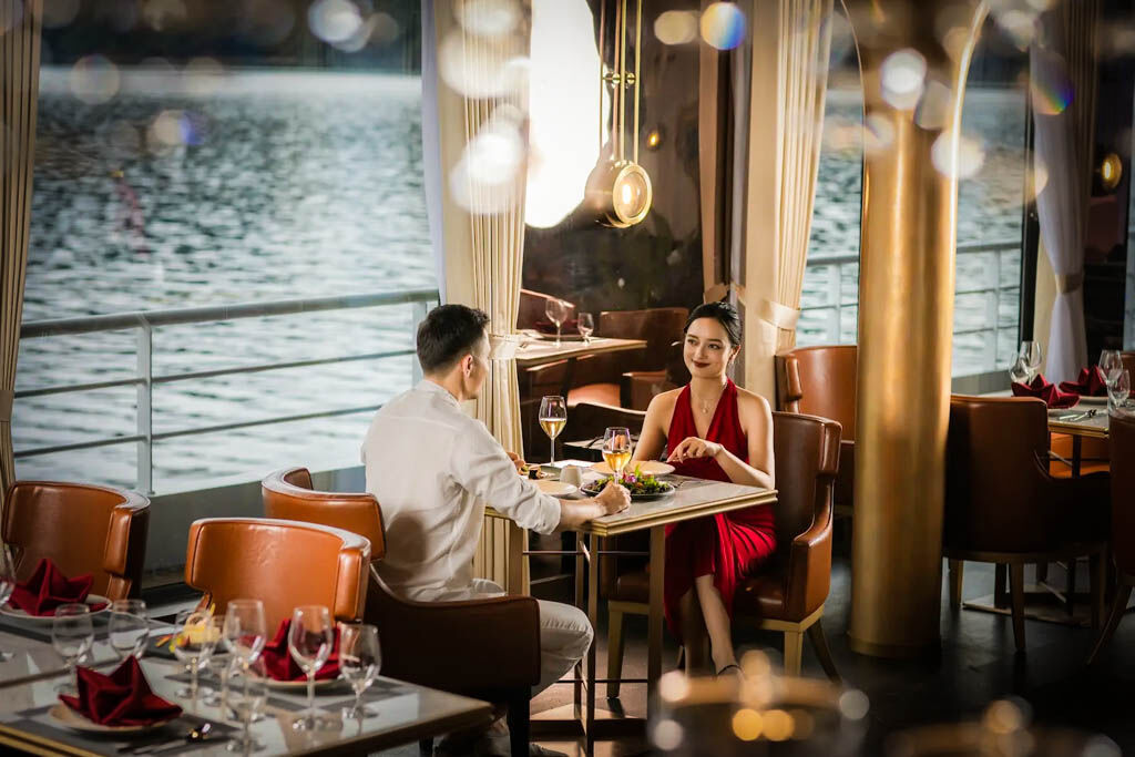 Savor gourmet dining while anchored among Halong Bay’s islands